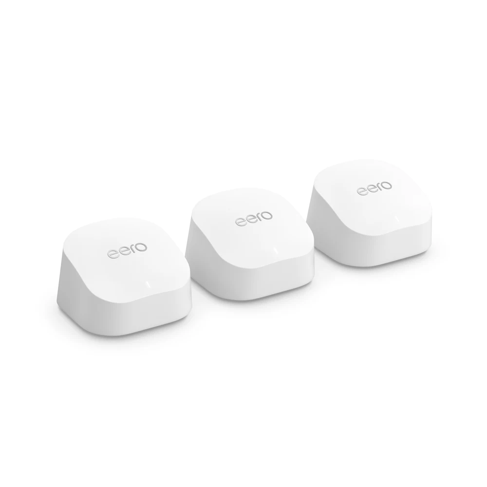 Official product photograph showing three white eero 6+ units.